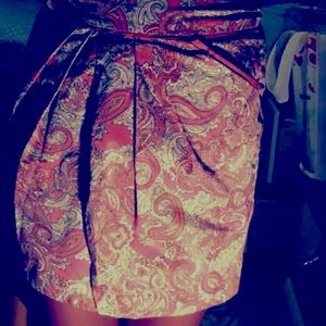 Coral color skirt with bandana type design.